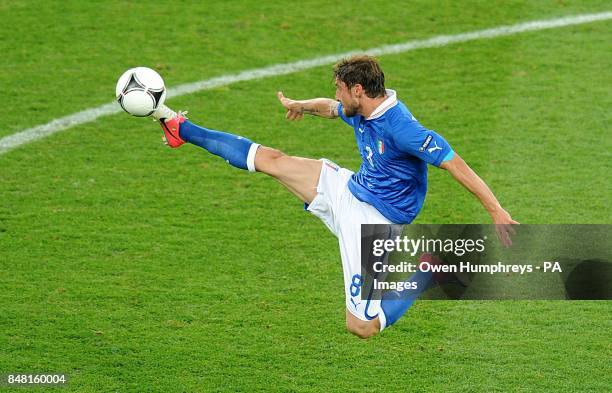 Italy's Claudio Marchisio acrobatically controls the ball