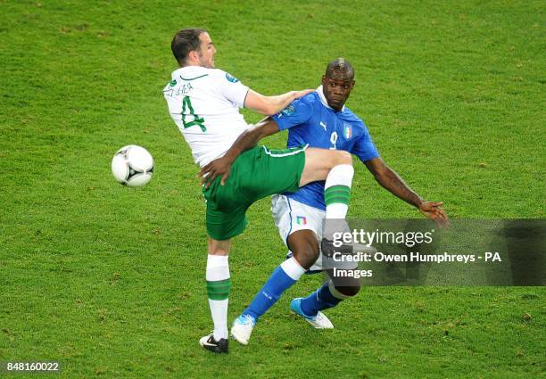 Republic of Ireland's John O'Shea and Italy's Mario Balotelli battle for the ball