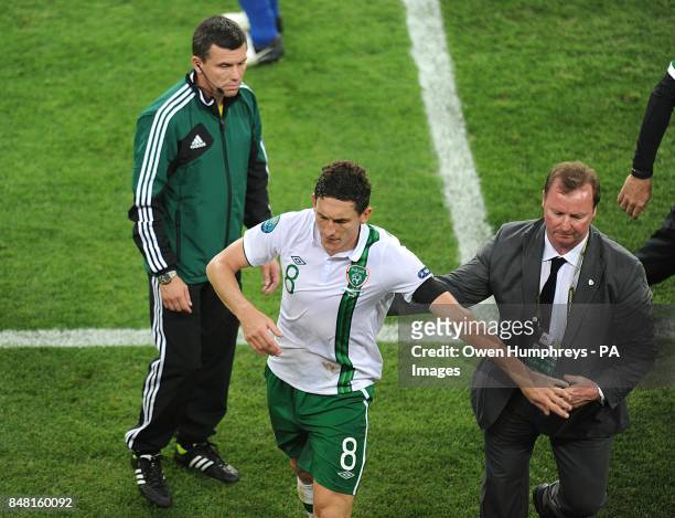 Republic of Ireland's Keith Andrews leaves the field of play after being shown a red card