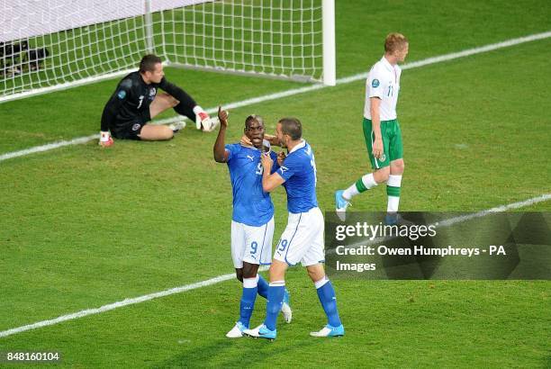 Italy's Mario Balotelli is congratulated by team mate Leonardo Bonucci after he scores their side's second goal of the game