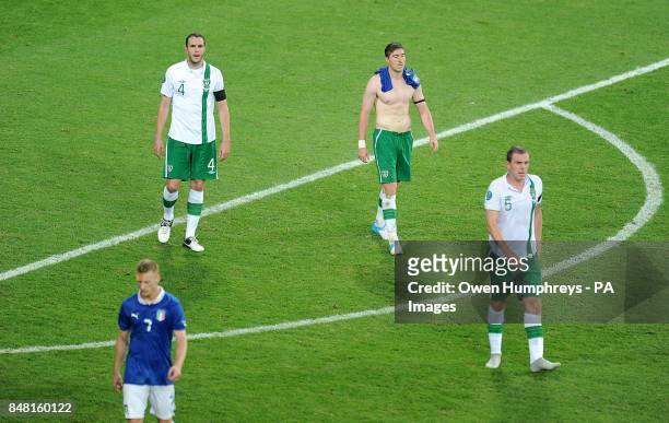 Republic of Ireland's John O'Shea , Stephen Ward and Richard Dunne look dejected after the final whistle