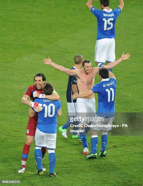 Italy goalkeeper Gianluigi Buffon and Antonio Cassano celebrate with their team mates after the final whistle