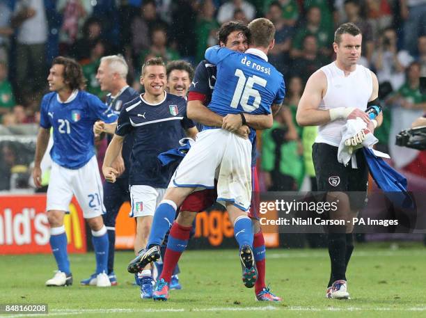 Republic of Ireland's Shay Given walks off dejected as Italy players celebrate victory during the UEFA Euro 2012 Group match at the Municipal...