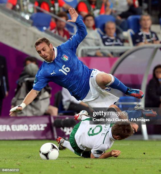 Republic of Ireland's Kevin Doyle challenges Italy's Daniele De Rossi during the UEFA Euro 2012 Group match at the Municipal Stadium, Poznan, Poland.