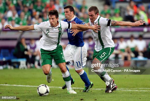 Republic of Ireland's Sean St Ledger and Richard Dunne block Italy's Antonio Di Natale during the UEFA Euro 2012 Group match at the Municipal...