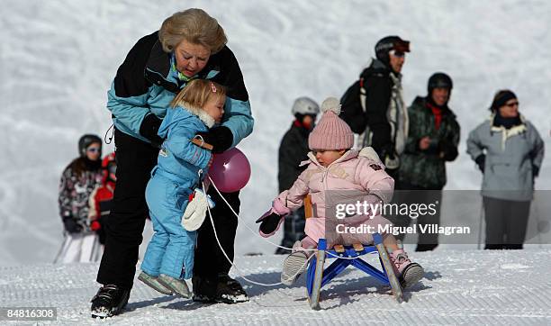 Queen Beatrix plays with Princess Ariane and Countess of Orange Leonore at the start of annual Austrian skiing holiday of the Dutch Royal family at...