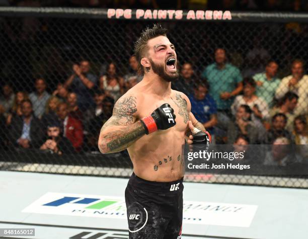 Mike Perry celebrates after defeating Alex Reyes in their welterweight bout during the UFC Fight Night event inside the PPG Paints Arena on September...