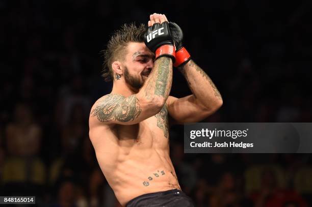 Mike Perry celebrates after defeating Alex Reyes in their welterweight bout during the UFC Fight Night event inside the PPG Paints Arena on September...