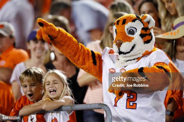 Clemson Tigers mascot and fans celebrate in the fourth quarter of a game against the Louisville Cardinals at Papa John's Cardinal Stadium on...