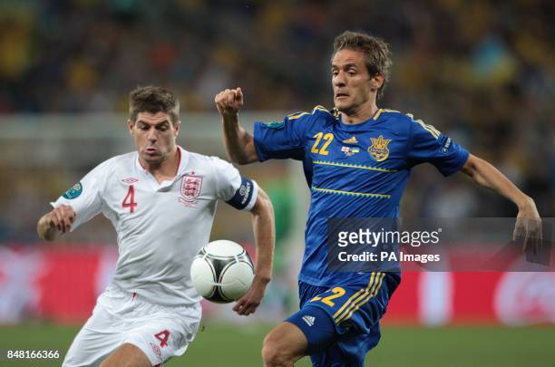 England's Steven Gerrard and Ukraine's Marko Devic battle for the ball