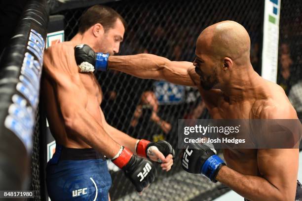 David Branch punches Luke Rockhold in their middleweight bout during the UFC Fight Night event inside the PPG Paints Arena on September 16, 2017 in...