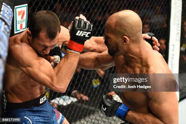 David Branch punches Luke Rockhold in their middleweight bout during the UFC Fight Night event inside the PPG Paints Arena on September 16, 2017 in...