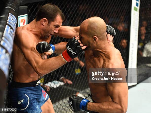 David Branch punches Luke Rockhold in their middleweight bout during the UFC Fight Night event inside the PPG Paints Arena on September 16, 2017 in...