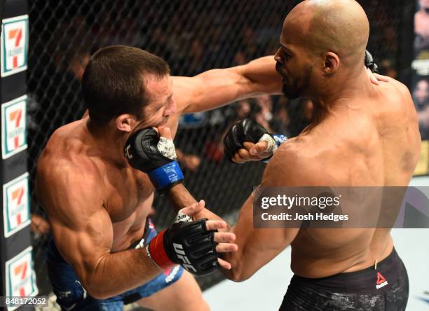 David Branch punches Luke Rockhold in their middleweight bout during the UFC Fight Night event inside the PPG Paints Arena on September 16, 2017 in...