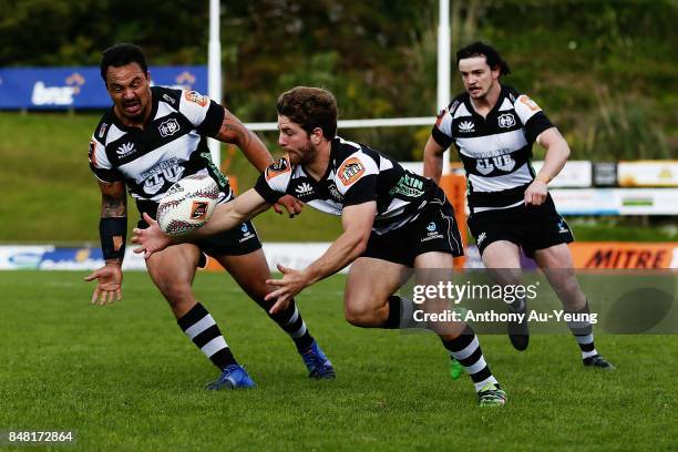 Mason Emerson, Ash Dixon and Richard Buckman of Hawke's Bay look to pick up a loose ball during the round five Mitre 10 Cup match between Counties...