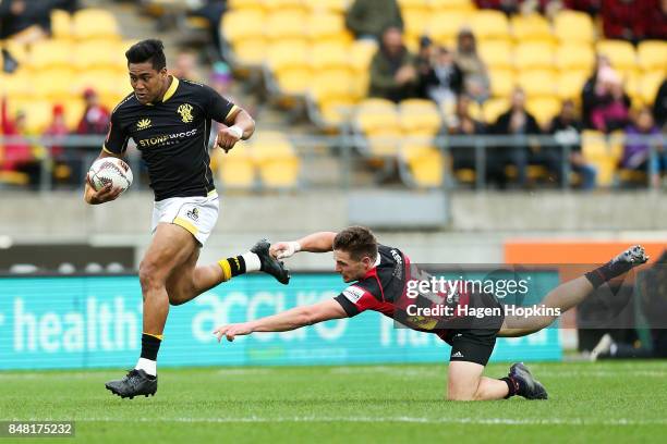 Julian Savea of Wellington beats the tackle of George Bridge of Canterbury during the round five Mitre 10 Cup match between Wellington and Canterbury...