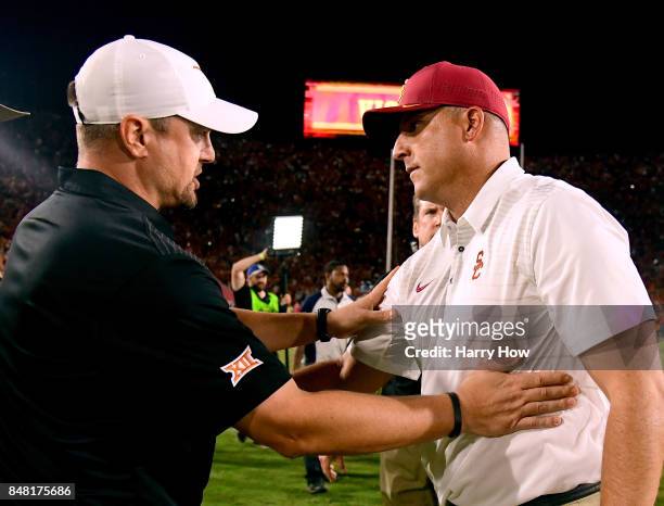 Head coach Clay Helton of the USC Trojans meets head coach Tom Herman of the Texas Longhorns at the end of the game after a 27-24 Trojan win in...