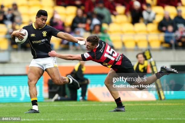 Julian Savea of Wellington beats the tackle of George Bridge of Canterbury during the round five Mitre 10 Cup match between Wellington and Canterbury...