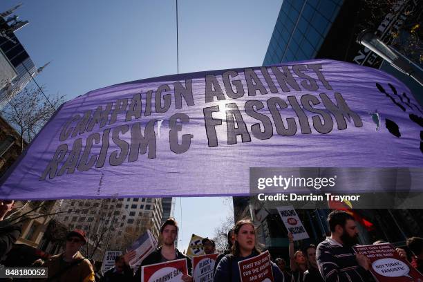 Protesters walks along Swanston Street on September 17, 2017 in Melbourne, Australia. Left-wing group Campaign Against Racism and Fascism organised a...