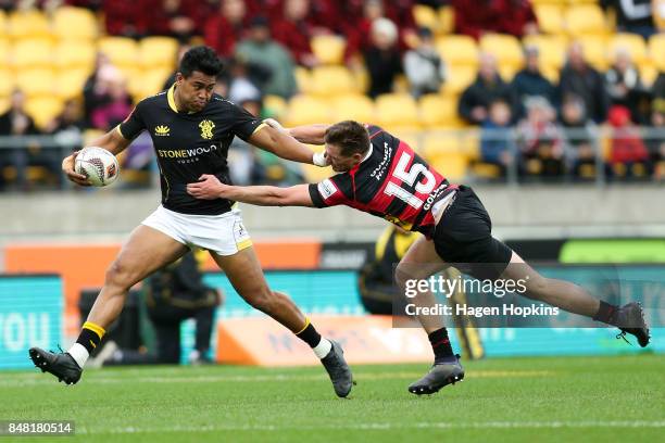 Julian Savea of Wellington beats the tackle of George Bridge of Canterbury during the round five Mitre 10 Cup match between Wellington and Canterbury...