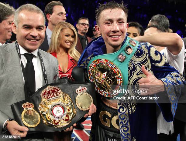 Gennady Golovkin of Kazakhstan shows his title belts following his WBC, WBA and IBF middleweight championship fight with Canelo Alvarez at the...