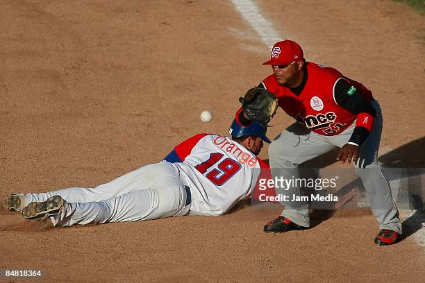 Jose Bautista of Republica Dominicana and Carlos Rivera of Puerto Rico in 1st base during the Caribbean series 2009 on February 6, 2009 in Mexicali,...