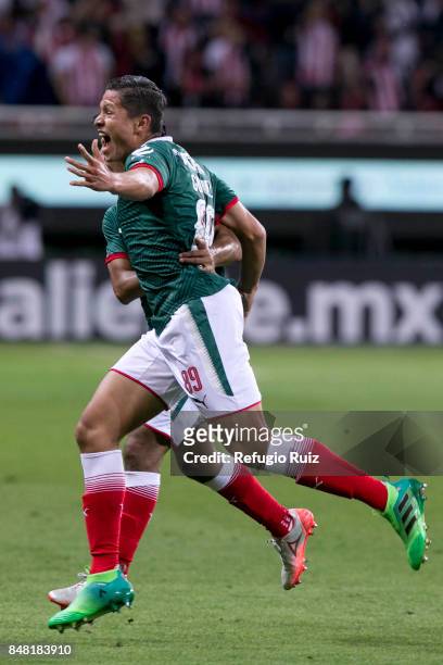 Jesus Godinez of Chivas celebrates after scoring the first goal of his team during the 9th round match between Chivas and Pumas UNAM as part of the...