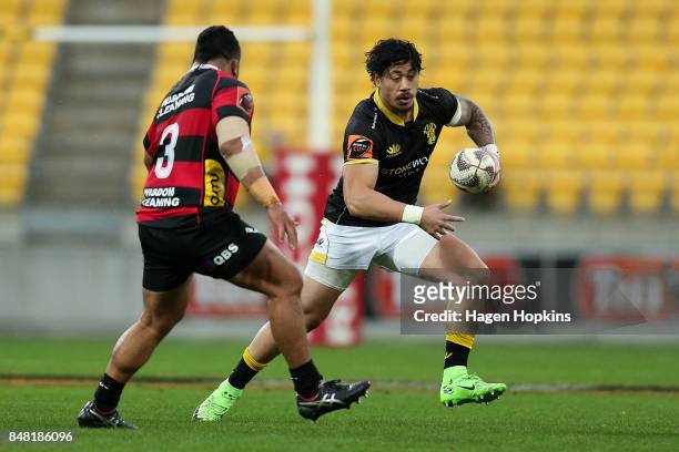 Ben Lam of Wellington looks to evade the defence of Siate Tokolahi of Canterbury during the round five Mitre 10 Cup match between Wellington and...