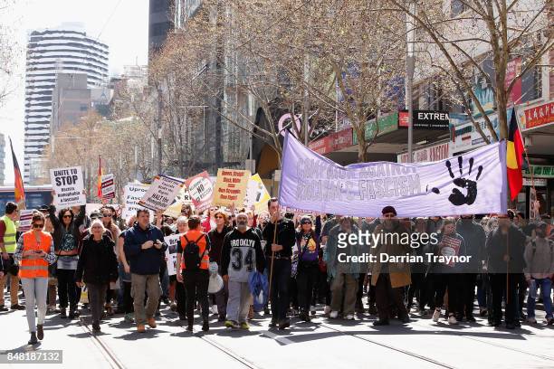 Protesters walks along Swanston Street on September 17, 2017 in Melbourne, Australia. Left-wing group Campaign Against Racism and Fascism organised a...