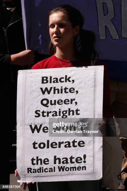 Left wing protesters hold up signs on September 17, 2017 in Melbourne, Australia. Left-wing group Campaign Against Racism and Fascism organised a...