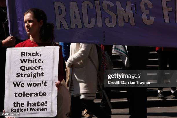 Left wing protesters hold up signs on September 17, 2017 in Melbourne, Australia. Left-wing group Campaign Against Racism and Fascism organised a...