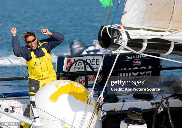 British yachtswoman Dee Caffari celebrates as she crosses the finish line in 6th place during the Vendee Globe solo round-the-world yacht race on...