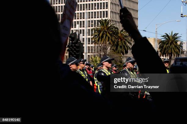 Police monitor the protest on September 17, 2017 in Melbourne, Australia. Left-wing group Campaign Against Racism and Fascism organised a rally to...