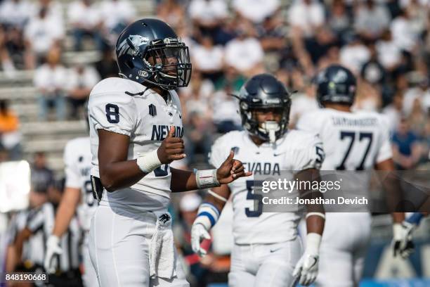 Quarterback Kaymen Cureton of the Nevada Wolf Pack signals to the sideline during the game against the Idaho State Bengals at Mackay Stadium on...