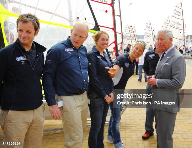 The Prince of Wales , talks to British Olympic 470 sailor Saskia Clark during a visit to the Weymouth and Portland National Sailing Academy in...