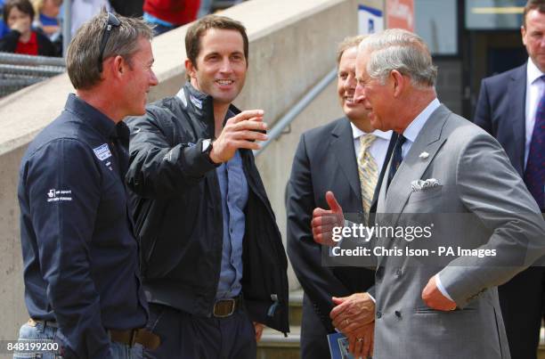 The Prince of Wales , talks to British Olympic triple gold medal winning sailor Ben Ainslie and Squad Manager Stephen Park during a visit to the...