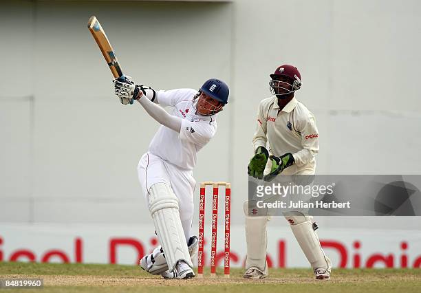 Stuart Broad of England hits out at the bowling of Sulieman Benn on day two of The 3rd Test between the West Indies and England played at The Antigua...