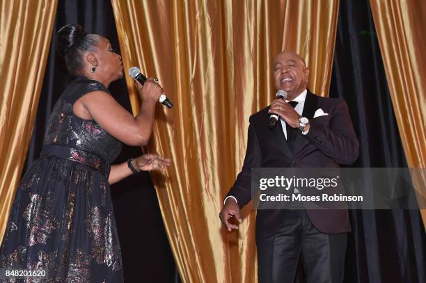 Recording artist Regina Belle and recording artist Peabo Bryson perform at the 2017 DMF Care for Congo Gala at St. Regis Hotel on September 16, 2017...