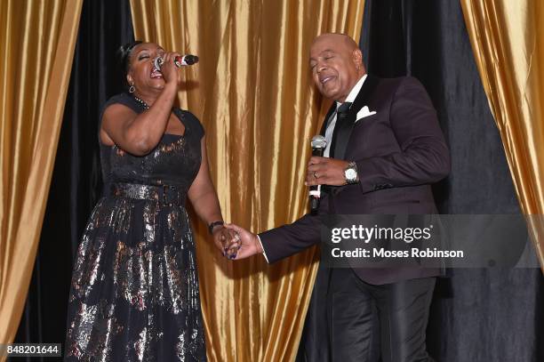 Recording artist Regina Belle and recording artist Peabo Bryson perform at the 2017 DMF Care for Congo Gala at St. Regis Hotel on September 16, 2017...