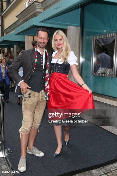 Photographer Sebastian Copeland and his wife Carolin Copeland during the 'Fruehstueck bei Tiffany' at Tiffany Store ahead of the Oktoberfest on...