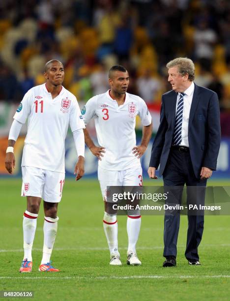 England Head Coach Roy Hodgson with Ashley Young and Ashley Cole after losing the penalty shoot out