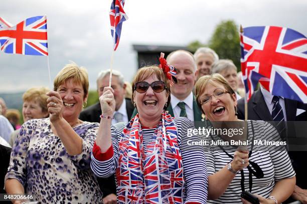 Crowds wait in the grounds of the Stormont Estate, Belfast for Queen Elizabeth II and Duke of Edinburgh to arrive, during a two-day visit to Northern...