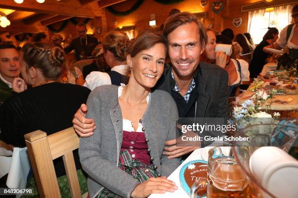 Tino Schuster and his grilfriend Carolin Pohl during the 'Fruehstueck bei Tiffany' at Schuetzenfesthalle at the Oktoberfest on September 16, 2017 in...