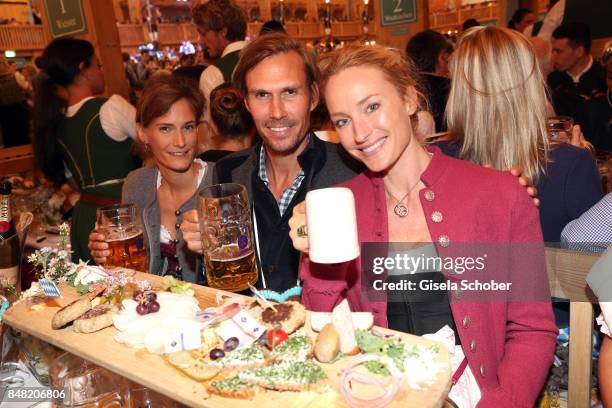 Carolin Pohl, Tino Schuster and Petra Winter during the 'Fruehstueck bei Tiffany' at Schuetzenfesthalle at the Oktoberfest on September 16, 2017 in...