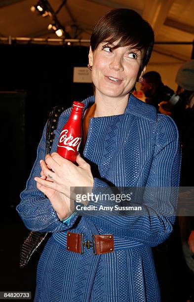 Actress Zoe McLellan poses backstage with a new Coca-Cola aluminum bottle at the Tracy Reese Fall 2009 fashion show during Mercedes-Benz Fashion Week...