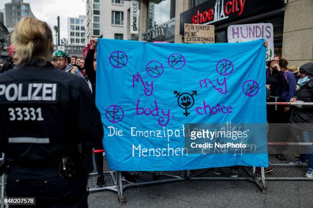 Counter-demonstrator stand behind a barricade in Berlin, Germany, on 16 September 2017. Under the motto &quot;Protect the most vulnerable, yes to...