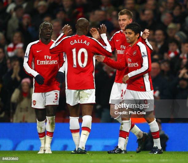 Nicklas Bendtner of Arsenal celebrates with team mates Eduardo , William Gallas and Bacary Sagna after he scores the second goal of the game during...