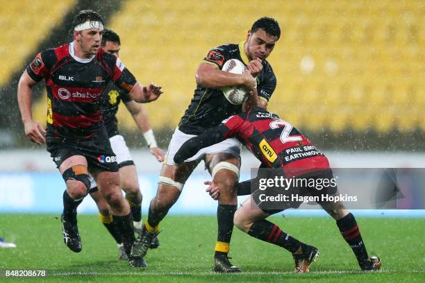 Teariki Ben-Nicholas of Wellington is tackled by Ben Funnell of Canterbury during the round five Mitre 10 Cup match between Wellington and Canterbury...