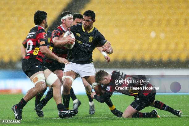 Teariki Ben-Nicholas of Wellington is tackled by Ben Funnell of Canterbury during the round five Mitre 10 Cup match between Wellington and Canterbury...