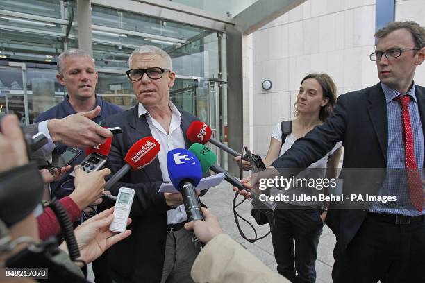 Bass guitarist Adam Clayton talks to the media as he leaves Dublin Circuit Criminal Court where his former personal assistant has been found guilty...